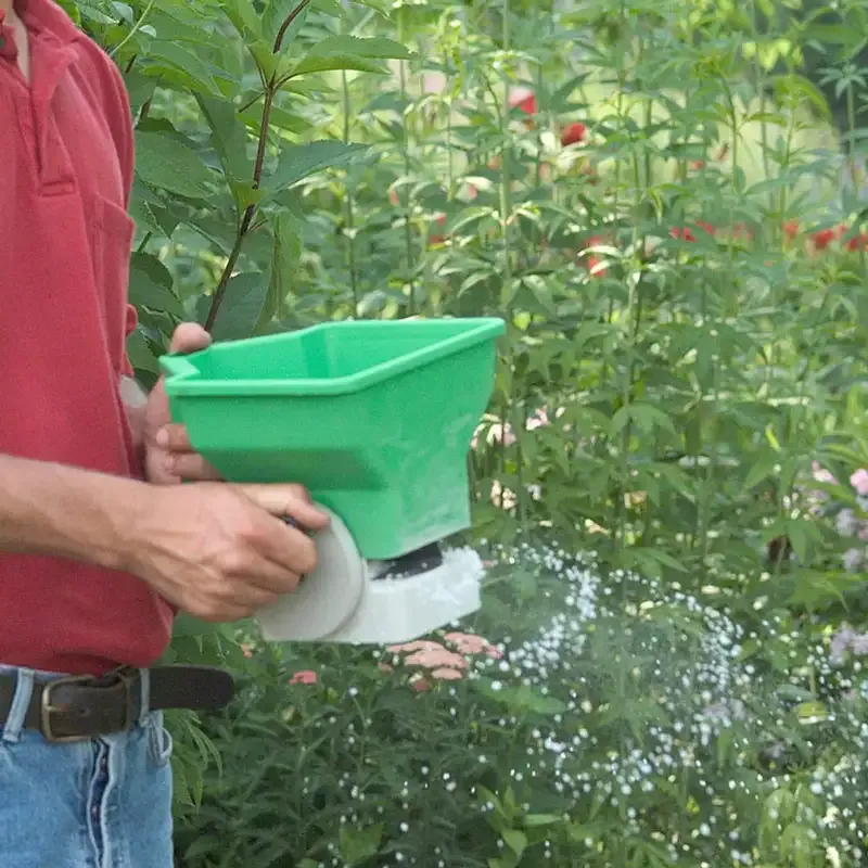 Handheld Broadcast Seed and Fertilizer Spreader with Adjustable Flow Control